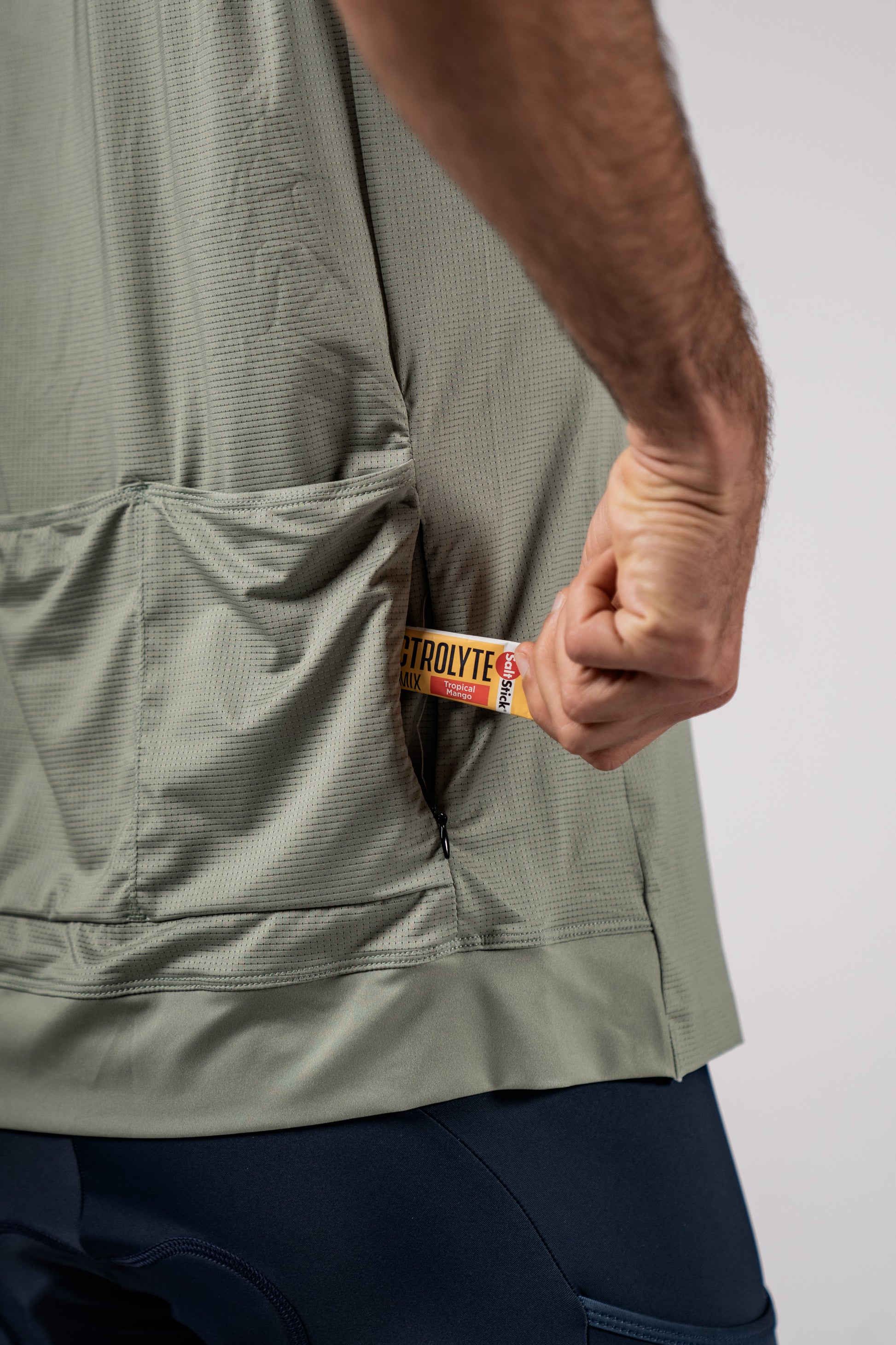 Close up of bottom of the back of a cycling jersey with extra pockets designed by Varlo.