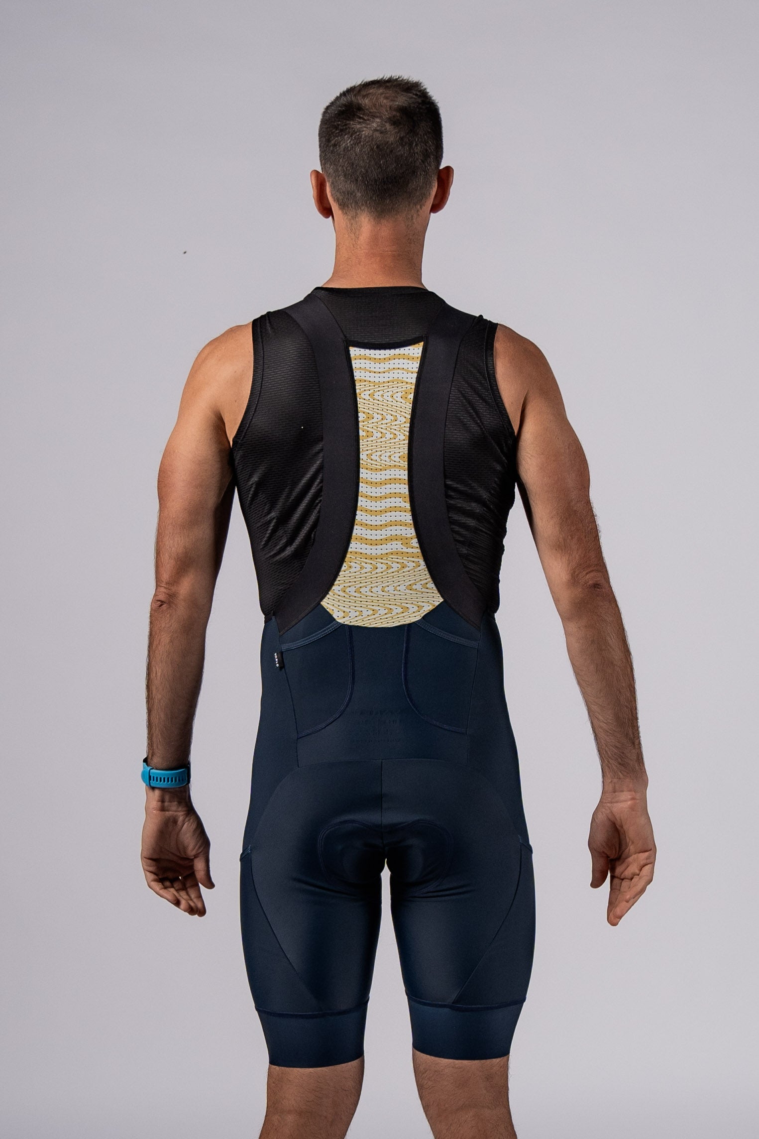 Back view of male model in Varlo cycling bib shorts.