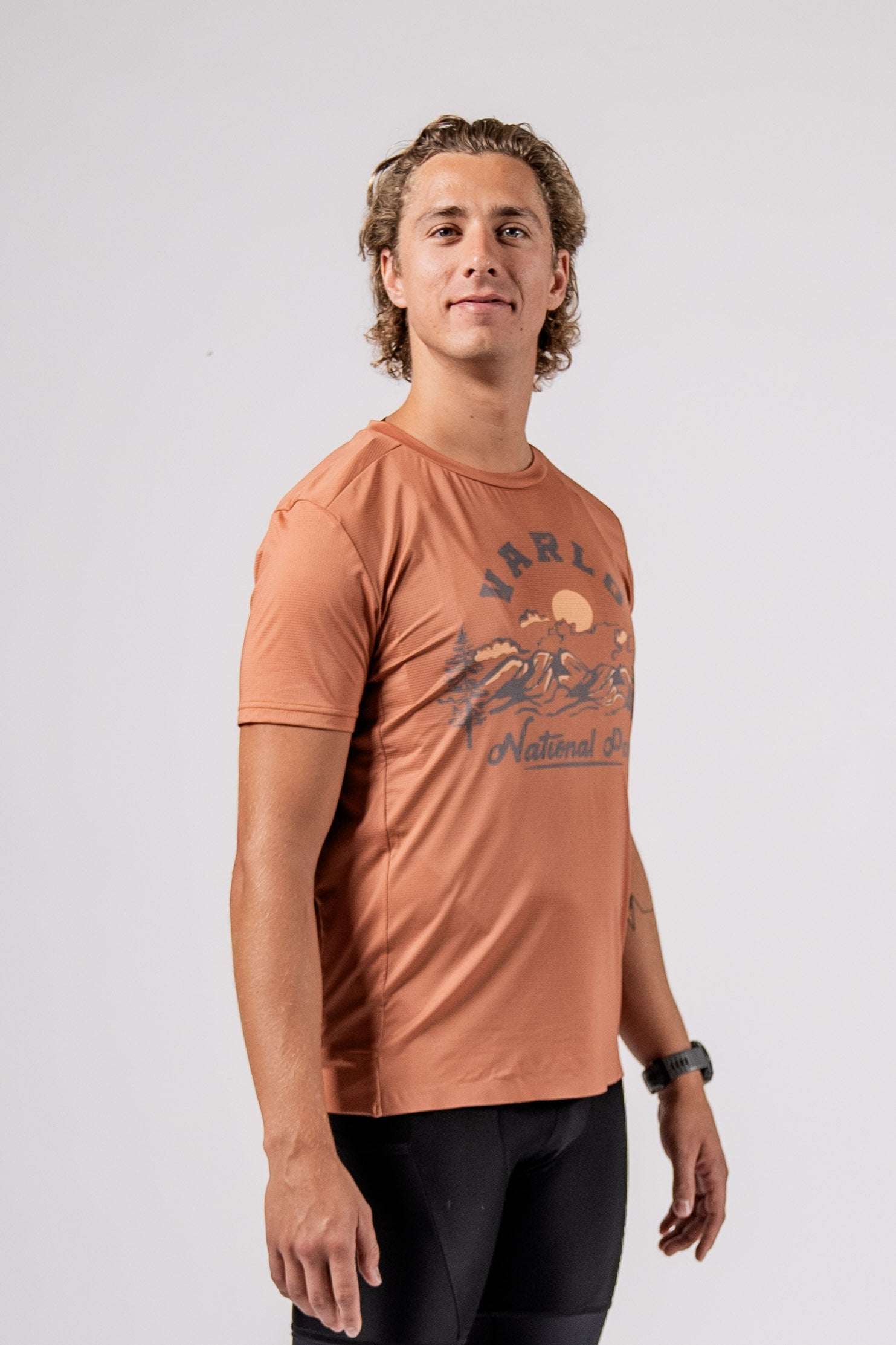 Studio shot of male model in the explorer cycle crew shirt parkroad tan in the Varlo 2025 gravel series.