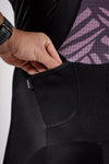 Rear left pocket of the mens roam cargo cycling bib shorts in Varlo's pulse purple.